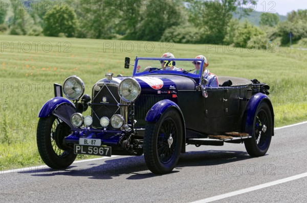 A blue classic car on a country road on a sunny day, classic car, car race, Mille Miglia, 1000 Miglia, 2015, Tuscany, Rome Lake Garda, Italy