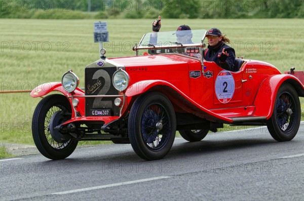 Red vintage car with a smiling woman on a rural road, vintage car, car race, Mille Miglia, 1000 Miglia, 2015, Tuscany, Rome Lake Garda, Italy