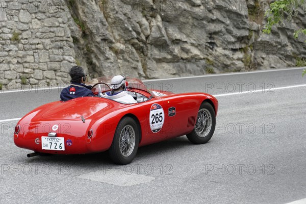 No. 265, O.S.C.A. MTA 1500 2AD, year of construction 1953, red vintage car driving on a road with stony scenery, Mille Miglia 2014 or 1000 Miglia, classic car race, San Marino, Italy