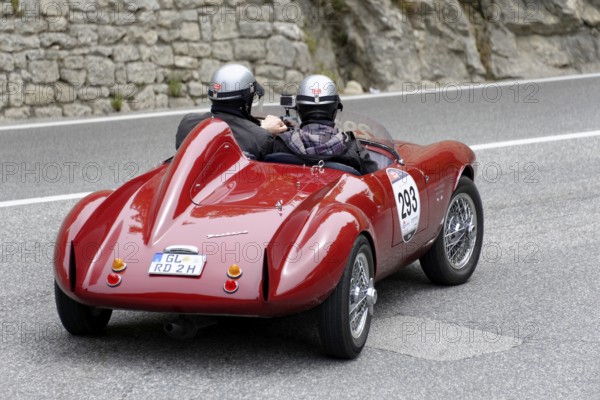No. 293, Bianchi Panhard 750 Sport Colli, built in 1954, two people with helmets driving a red vintage convertible with mounted camera, Mille Miglia 2014 or 1000 Miglia, vintage car race, San Marino, Italy