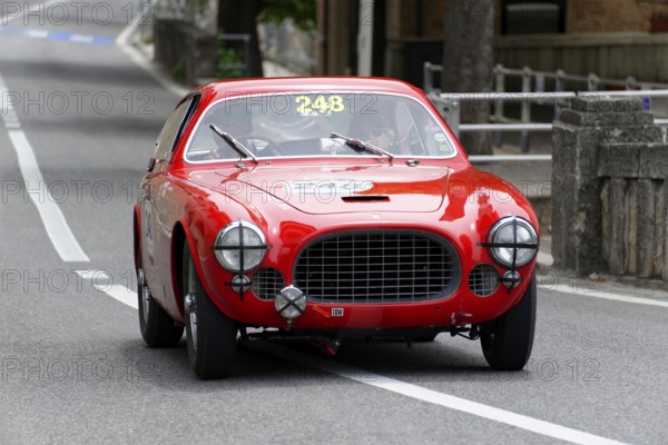 No. 248, Ferrari 225 S berinetta Vignale, built in 1952, A red classic car with a closed body drives down a road during a rally, Mille Miglia 2014 or 1000 Miglia, classic car race, San Marino, Italy