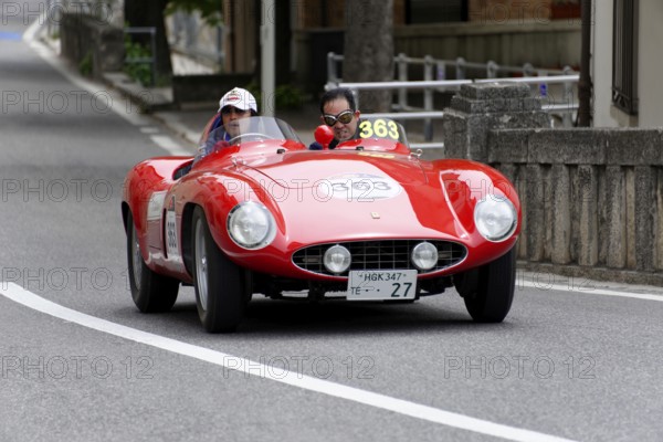 No. 363, Ferrari 750 Monza spider Scaglietti, year of construction 1955, Two people driving a red vintage convertible racing car on a country road, Mille Miglia 2014 or 1000 Miglia, vintage car race, San Marino, Italy