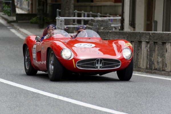 No. 373, Maserati 300 S Fantuzzi, year of construction 1955, red sports car driving on a straight road, visible from the front, Mille Miglia 2014 or 1000 Miglia, classic car race, San Marino, Italy