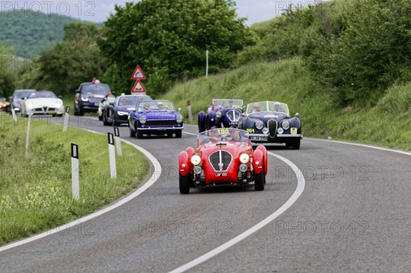 Group of classic cars driving in a row on a winding country road, classic car, car race, Mille Miglia, 1000 Miglia, 2015, Tuscany, Rome Lake Garda, Italy