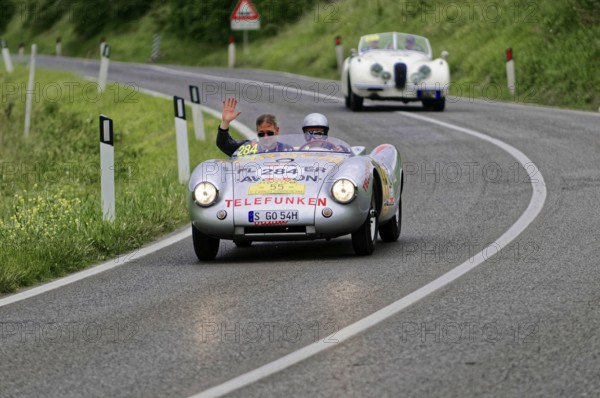 Silver classic car on country road, two people waving from the vehicle, classic car, car race, Mille Miglia, 1000 Miglia, 2015, Tuscany, Rome Lake Garda, Italy