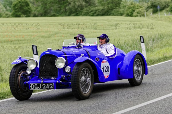 Two people in a blue vintage car on a country road, vintage car, car race, Mille Miglia, 1000 Miglia, 2015, Tuscany, Rome Lake Garda, Italy