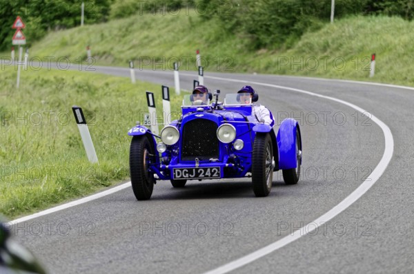 Blue vintage racing car with two people on a country road, classic car, car race, Mille Miglia, 1000 Miglia, 2015, Tuscany, Rome Lake Garda, Italy