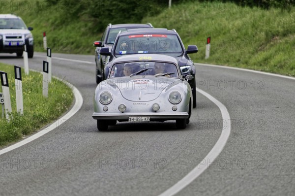 Silver classic car leads a group of cars on the road, classic car, car race, Mille Miglia, 1000 Miglia, 2015, Tuscany, Rome Lake Garda, Italy