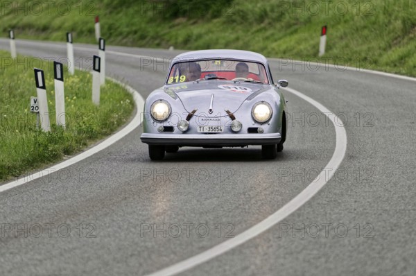 Silver classic car on a winding road through green hills, classic car, car race, Mille Miglia, 1000 Miglia, 2015, Tuscany, Rome Lake Garda, Italy
