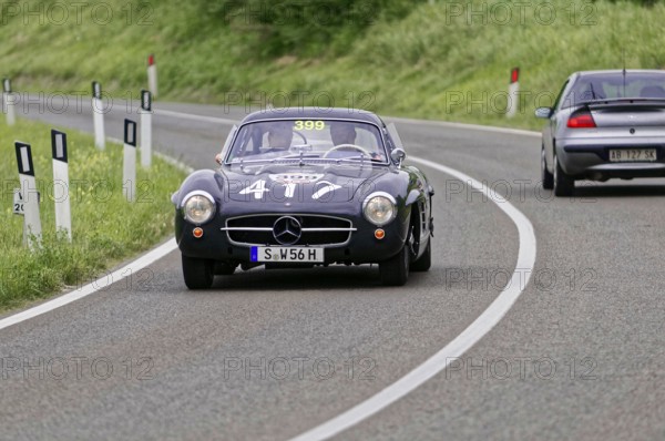 Black Mercedes classic car on a winding country road during a race, classic car, car race, Mille Miglia, 1000 Miglia, 2015, Tuscany, Rome Lake Garda, Italy