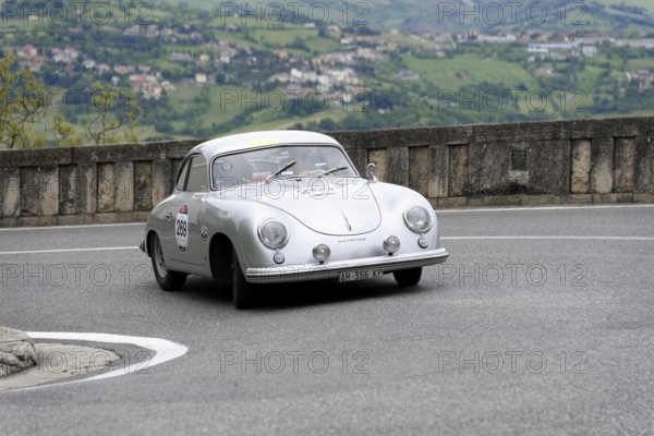 No. 269, Porsche 356 1500, built in 1953, white vintage coupé on a winding road with picturesque mountain scenery, Mille Miglia 2014 or 1000 Miglia, classic car race, San Marino, Italy