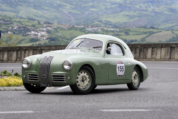 No. 155, FIAT 1100 S berlinetta Gobbone, Green vintage car driving alone on a winding road in a hilly landscape, Mille Miglia 2014 or 1000 Miglia, vintage car race, San Marino, Italy