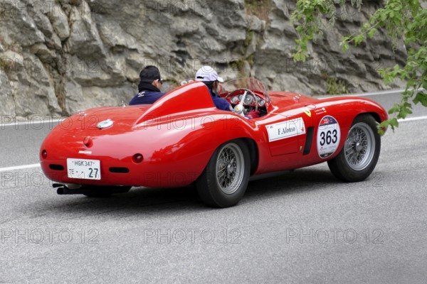 No. 363, Ferrari 750 Monza spider Scaglietti, year of construction 1955, red vintage car with two occupants on a winding road, Mille Miglia 2014 or 1000 Miglia, vintage car race, San Marino, Italy