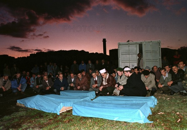 BIH, Sarajevo, September 1994 -- Muslim burial of victims of a grenade attack in Sarajevo. Fearing Serbian snipers, Muslims postponed their funerals just in front of sunset. Bosnia Hercogovina, Eastern Europe
