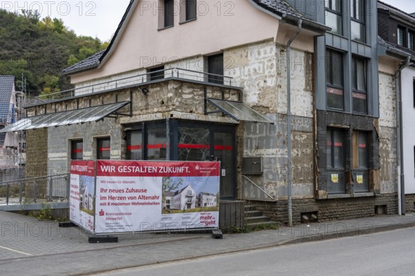 Reconstruction in the Ahr Valley, after the flood of July 2021, buildings that have not yet been renovated or demolished can be found in many towns, but most buildings have now been repaired or rebuilt, Sparkassen branch near Altenahr, Rhineland-Palatinate