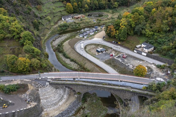 Reconstruction in the Ahr Valley, after the flood of July 2021, restoration of the railway infrastructure of the Ahr line, 29 km of tracks, 15 railway bridges, 7 were renovated, stations and stops renovated or renewed, 885 masts were built for the overhead line of the new electrification and 55 km of overhead lines were redrawn, here work on the cycle path bridge and railway bridge near Altenahr, old destroyed sewage treatment plant and temporary sewage treatment plant at the back Plant, Rhineland-Palatinate