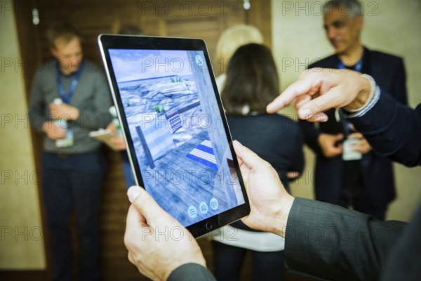 ITA Italy Castelfalfi participants try out a virtual tour via pad during a conference for tourism managers
