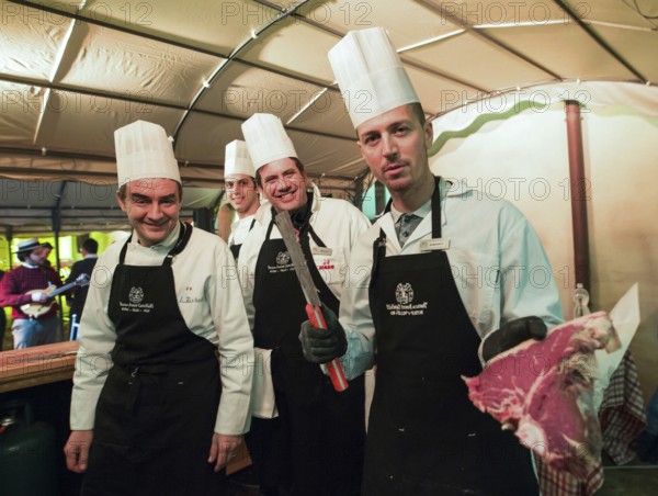 ITA Italy Castelfalfi chefs show the quality of meat during a meeting for tourism managers