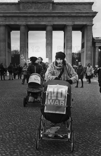 DEU, Germany, Berlin, 15.02.2003. Woman with stroller during a demonstration against the war in Iraq