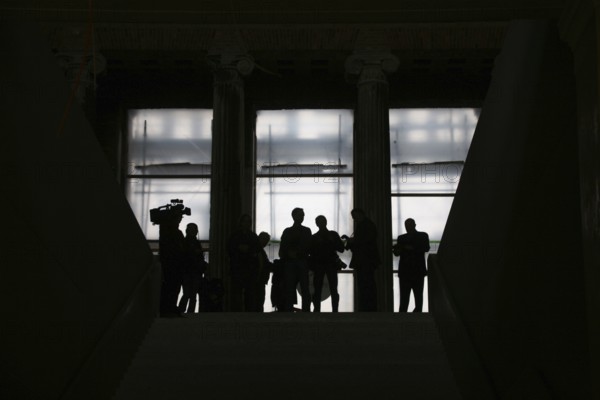 Media representatives wait at the end of the entrance steps at the start of the press tour in front of the official topping-out ceremony for the Neues Museum. Culture Museum Island History Art Architecture City Buildings Renovation Reconstruction