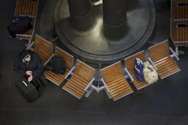 Berlin 2010-11-24 A woman waits for her train at Berlin Central Station. DEU Berlin 2010-11-24 A woman waits for her train at Berlin's main station