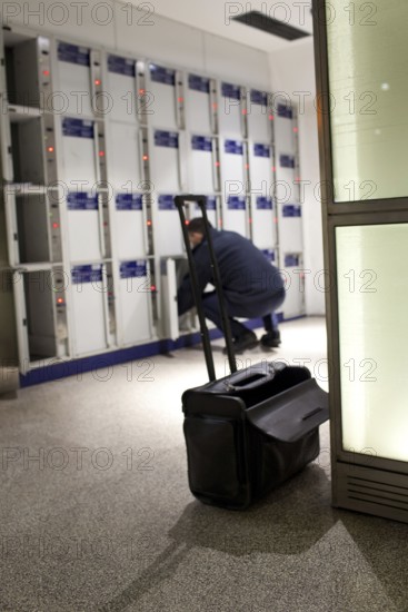 Berlin 2010-11-24 A railroad employee waits the lockers in the lowlands at Potsdamer Platz DEU Berlin 2010-11-24 A serviceman maintenances the lockers at Potsdamer Platz