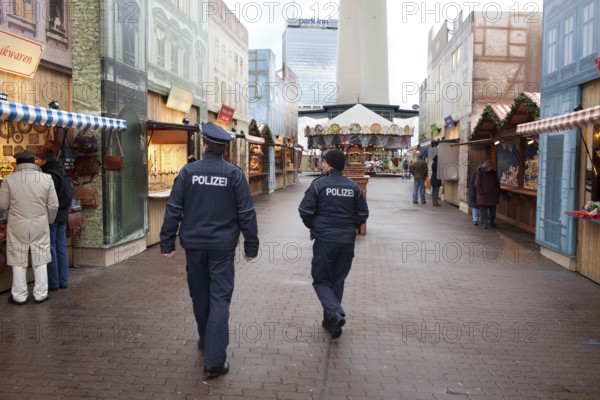 Berlin 2010-11-24 Police officers tour the Christmas market on Alexanderplatz. DEU, Berlin 2010-11-24 Police Guarding a Christmas Market in Downtown Berlin
