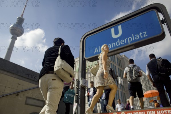 GERMANY Berlin People enter Alexanderplatz coming from the subway. Germany Berlin People coming from the underground entering Alexanderplatz