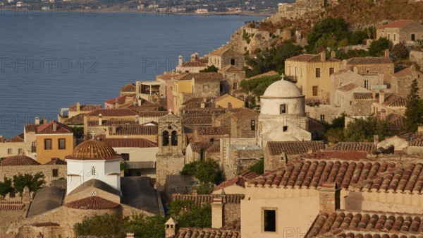 Soft morning light, Holy Church of the Virgin Mary Myrtidiotissa (or Criticias), Holy Church of Christ in Chains, Elkomenos Christos, Historic City on a Hill with Churches and Tiled Roofs Facing the Sea, Monemvasia, Monemvassia, Malvasy, Small Byzantine Town, Rock Island, Fortress, Laconia, Peloponnese, Peninsula, Greece