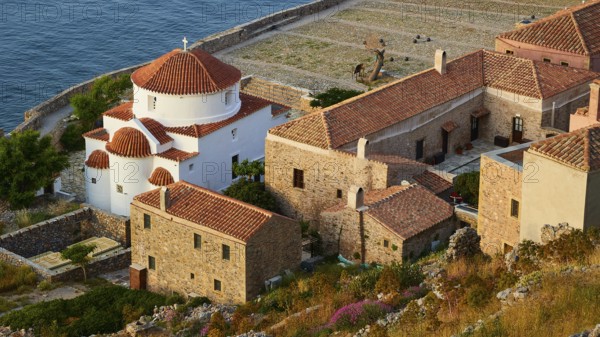 Soft morning light, Holy Church of the Virgin Mary Chrysaphitissa, beautiful coastal town with church and traditional buildings right by the sea, Monemvasia, Monemvassia, Malvasy, Byzantine small town, rocky island, fortress, Laconia, Peloponnese, peninsula, Greece