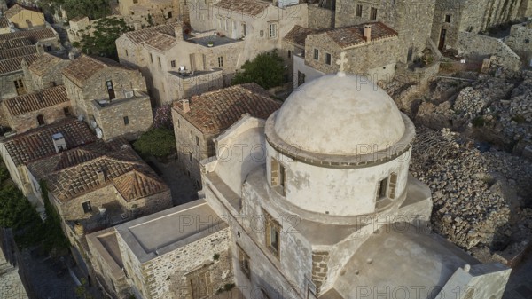 Drone view, historic church with dome surrounded by a village, taken from the air, Monemvasia, Monemvassia, Malvasy, Byzantine small town, rocky island, fortress, Laconia, Peloponnese, peninsula, Greece