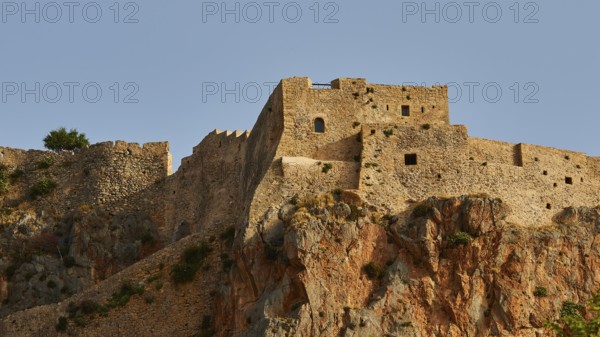 Stone fortress on rocky hill with reddish rock, Monemvasia, Monemvassia, Malvasy, small Byzantine town, rocky island, fortress, Laconia, Peloponnese, peninsula, Greece