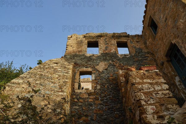 Soft morning light, the remains of an old stone building, window openings, blue sky, dilapidated, Monemvassia, Malvasy, Byzantine small town, rocky island, fortress, Laconia, Peloponnese, peninsula, Greece