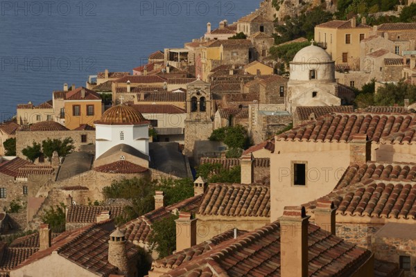 Soft morning light, Holy Church of the Virgin Mary Myrtidiotissa (or Critikias), Holy Church of Christ in Chains, Elkomenos Christos, view of a peaceful coastal town with churches and tiled roofs over the sea, Monemvasia, Monemvassia, Malvasy, small Byzantine town, rocky island, fortress, Laconia, Peloponnese, peninsula, Greece
