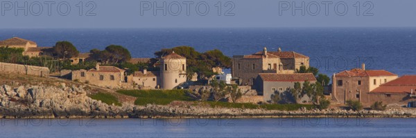 Coastal town with old stone buildings and tiled roofs by the sea, Monemvasia, Monemvassia, Malvasy, small Byzantine town, rocky island, fortress, Laconia, Peloponnese, peninsula, Greece