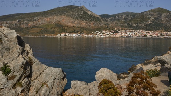 Quiet coastline with mountains in the background and a picturesque village, Monemvasia, Monemvassia, Malvasy, Byzantine small town, rocky island, fortress, Laconia, Peloponnese, peninsula, Greece