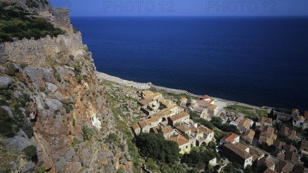 Coastal panorama with villages and cliffs falling down to the vast blue sea, Monemvasia, Monemvassia, Malvasy, small Byzantine town, rocky island, fortress, Laconia, Peloponnese, peninsula, Greece