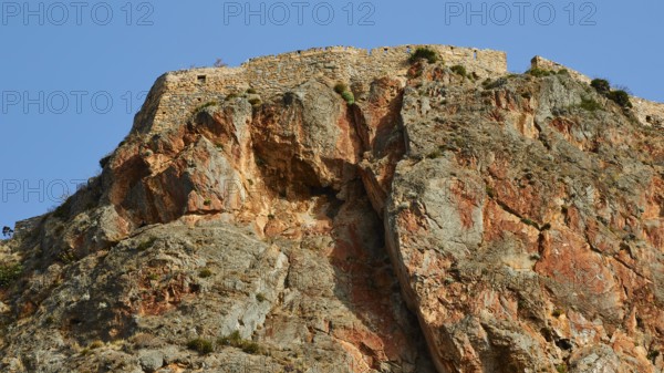 Dramatic rock formation rising against blue sky, Monemvasia, Monemvassia, Malvasy, Byzantine small town, rocky island, fortress, Laconia, Peloponnese, peninsula, Greece