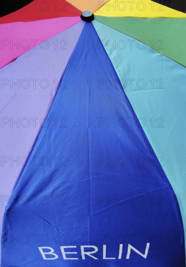 The Berlin font on an umbrella with all colors of the rainbow, symbolic photo, Berlin, Germany