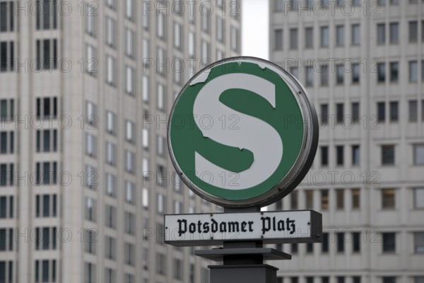 Old S-Bahn sign on Potsdamer Platz in front of modern skyscrapers, Berlin, Germany