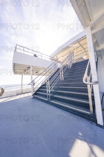 A steep staircase leads up to a deck, with a wide view of the sea, Schifffahrt, Lake Constance, Germany