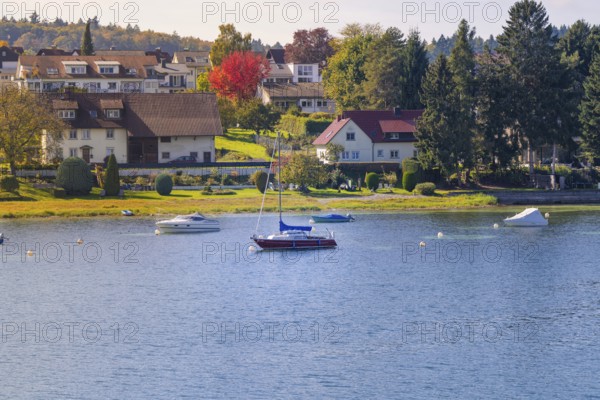 Seascape with colorful shore and various boats, boat trip, Lake Constance, Germany
