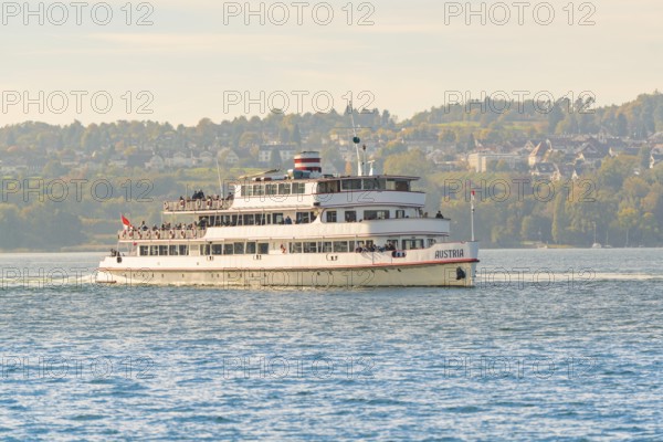 Large passenger ship on a lake with city and nature in the background, boat trip, Lake Constance, Germany