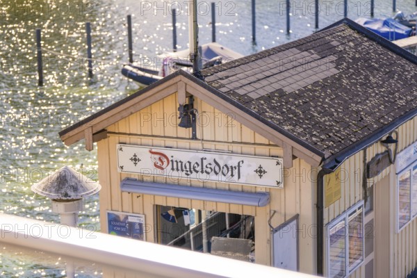 Close-up of a building at a pier in sunlight, boat trip, Lake Constance, Germany
