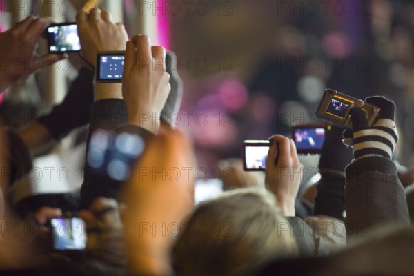 DEU, Germany, Berlin fans photograph Helena Bonham Carter in front of the premiere of 'The King's Speech' in Friedrichsstadt Palace. Germany Berlin fans take pictures of Helena Bonham Carter outside Friedrichsstadt Palace