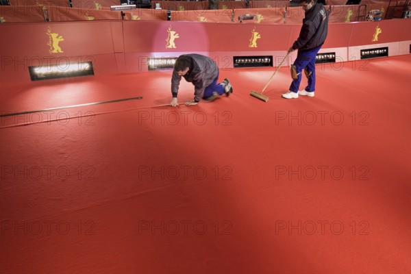 DEU, Germany, Berlin Workers lay the red carpet in front of the opening of the 61st Berlinale in front of the opening of the 61st Berlinale