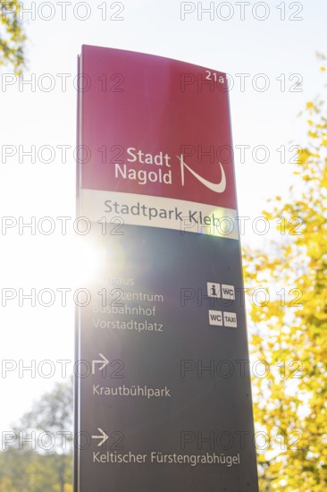 Signpost in Nagold City Park in autumn sunlight, Nagold, Black Forest, Germany