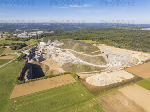 View of a large quarry with surrounding fields and forests, Nagold, Black Forest, Germany