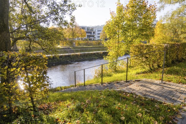 Autumn river trail with railings and surrounding trees, Nagold, Black Forest, Germany