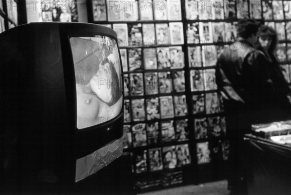 Berlin, DEU, 10.01.2000 -- Pornographic videos to watch and buy at the Berlin erotic fair: Messehalle am Alexanderplatz. -- © Karsten Thielker